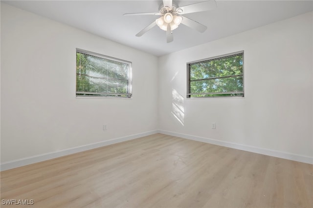 spare room featuring ceiling fan and light wood-type flooring