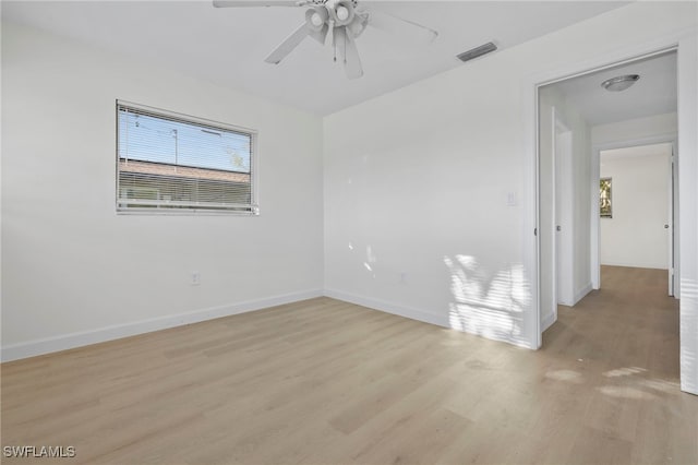 unfurnished room with ceiling fan and light hardwood / wood-style flooring