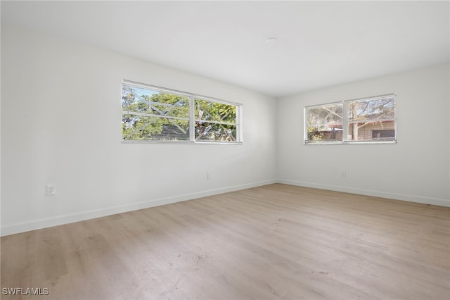 unfurnished room featuring light hardwood / wood-style flooring