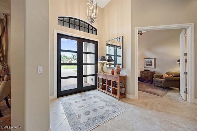 7721 Classics Dr, Naples, FL 34113 - entryway featuring a towering ceiling, tile patterned flooring, and french doors