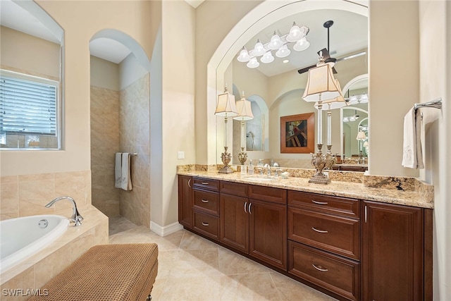 bathroom featuring ceiling fan, vanity, independent shower and bath, and tile patterned floors