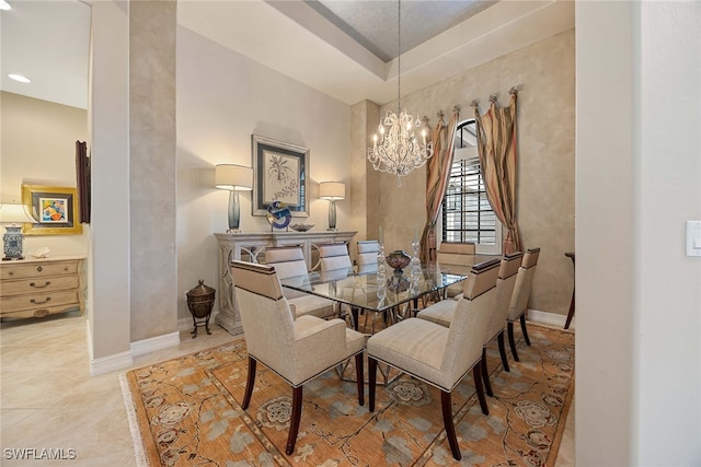 dining space with a notable chandelier and tile patterned floors