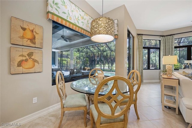 7721 Classics Dr, Naples, FL 34113 - tiled dining area featuring a sunroom, baseboards, and ceiling fan