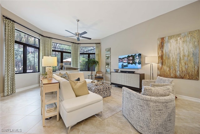 living room featuring ceiling fan and light tile patterned floors