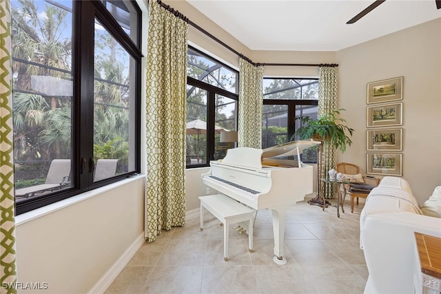 miscellaneous room with ceiling fan and light tile patterned floors