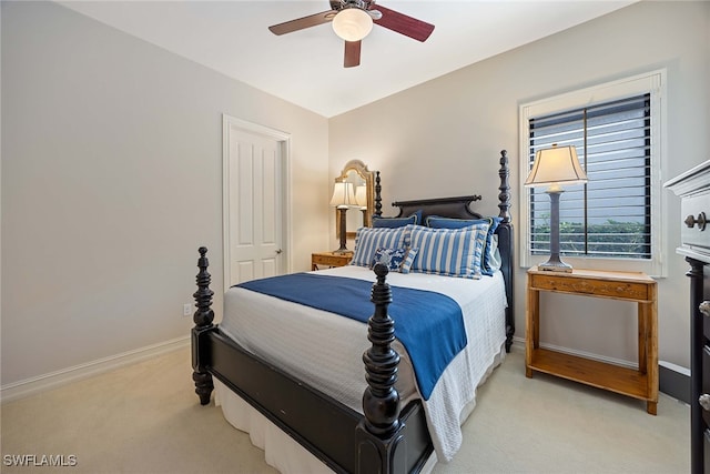 bedroom with ceiling fan and light carpet