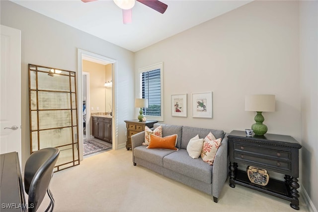 living room featuring ceiling fan and light colored carpet