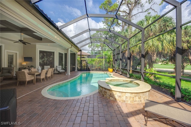 view of pool with ceiling fan, glass enclosure, an in ground hot tub, and a patio area