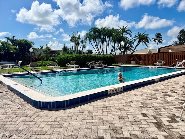 view of swimming pool featuring a patio area