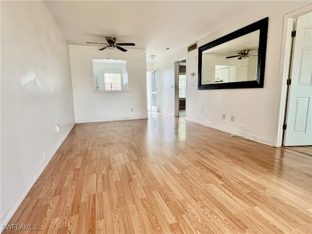 interior space with light hardwood / wood-style flooring and ceiling fan