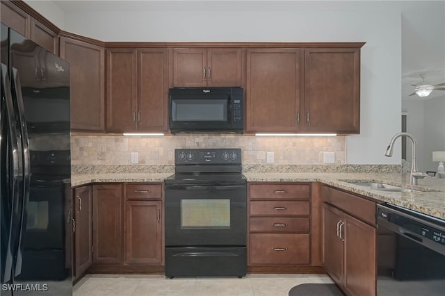 kitchen featuring black appliances, sink, ceiling fan, and decorative backsplash