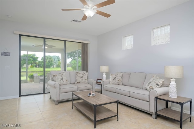 living room with ceiling fan and light tile patterned floors