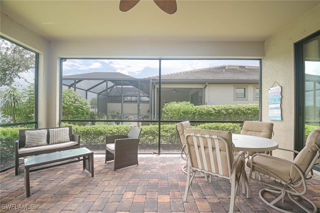 sunroom / solarium with ceiling fan