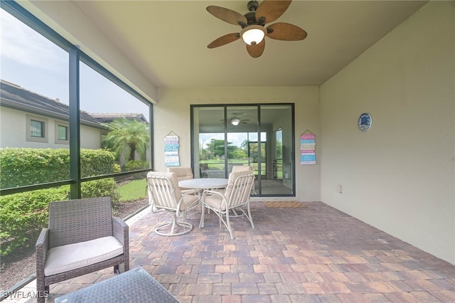 sunroom / solarium with ceiling fan