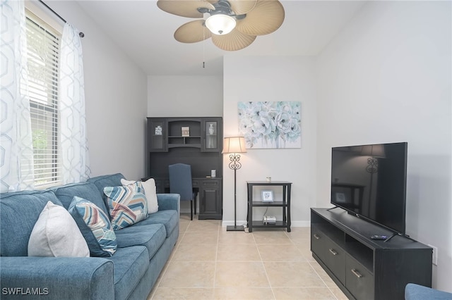 living room with plenty of natural light, light tile patterned floors, and ceiling fan