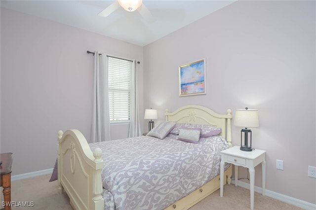 bedroom with ceiling fan and light carpet