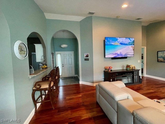 living room with dark hardwood / wood-style floors