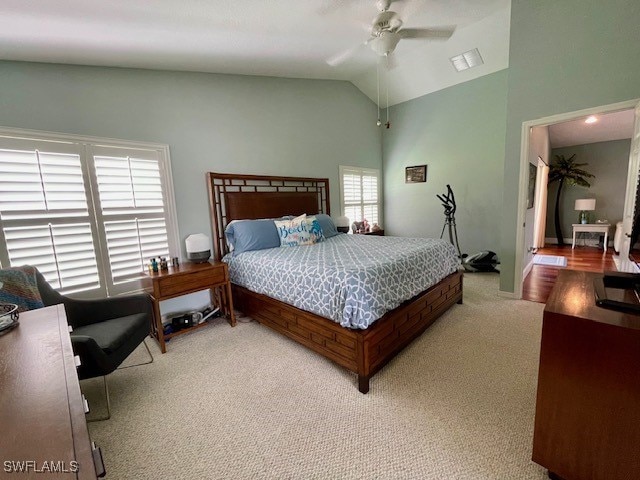 bedroom featuring carpet flooring, multiple windows, ceiling fan, and high vaulted ceiling