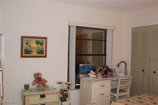 bedroom featuring a closet and a textured ceiling