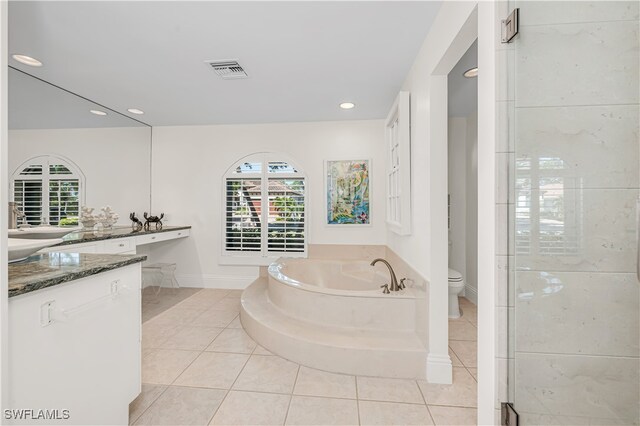 full bathroom with tile patterned flooring, vanity, toilet, and plus walk in shower