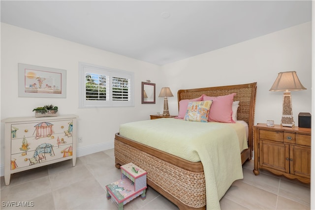 bedroom featuring light tile patterned floors