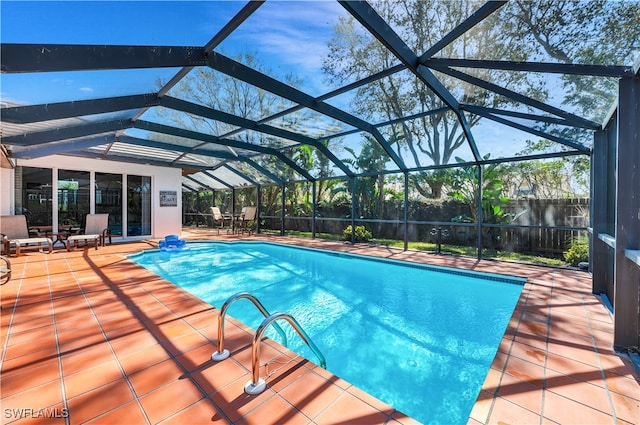 view of pool with a lanai and a patio area