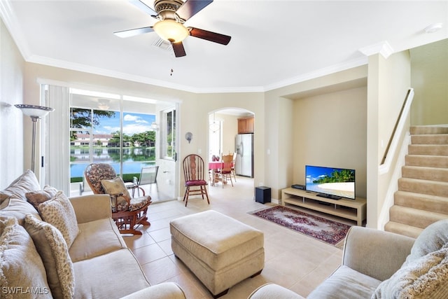 living room with ceiling fan, light tile patterned floors, and ornamental molding