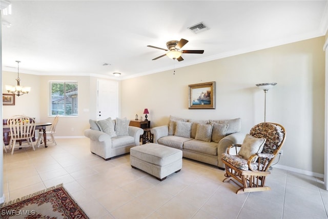 living room with ceiling fan with notable chandelier, crown molding, and light tile patterned floors