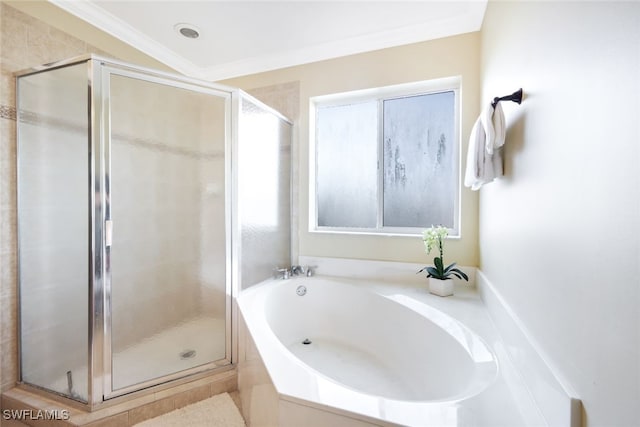 bathroom featuring plenty of natural light, shower with separate bathtub, and ornamental molding