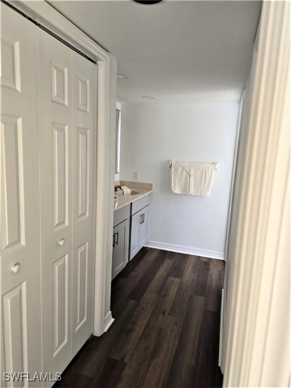 bathroom with vanity and hardwood / wood-style floors