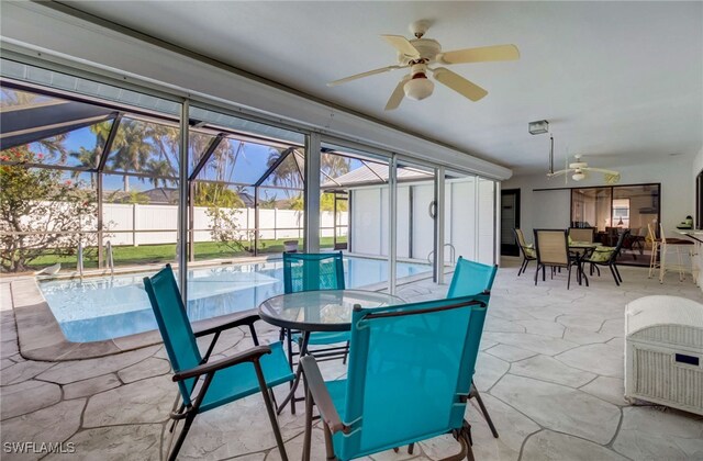 interior space with ceiling fan