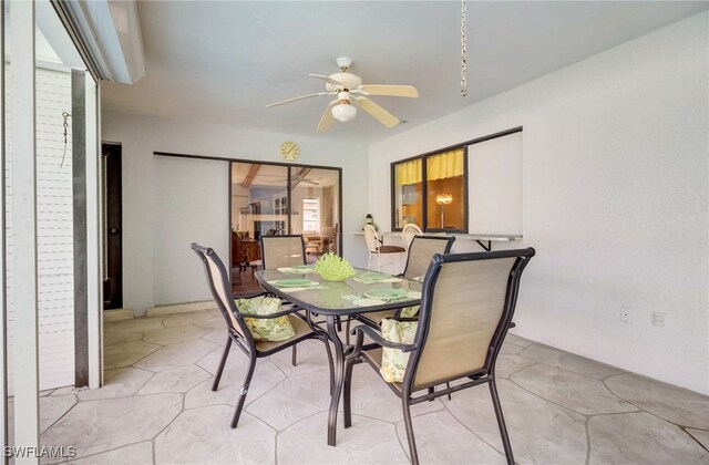 dining space featuring ceiling fan