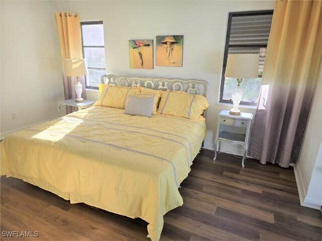 bedroom featuring dark wood-type flooring