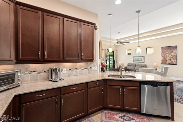 kitchen featuring kitchen peninsula, ceiling fan, hanging light fixtures, stainless steel dishwasher, and sink