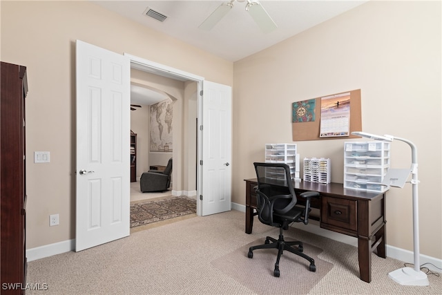 home office with ceiling fan and light colored carpet