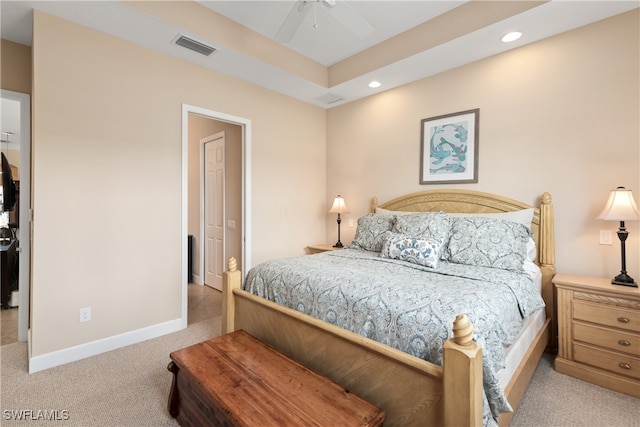 bedroom with ceiling fan and light colored carpet