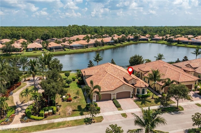 birds eye view of property with a water view