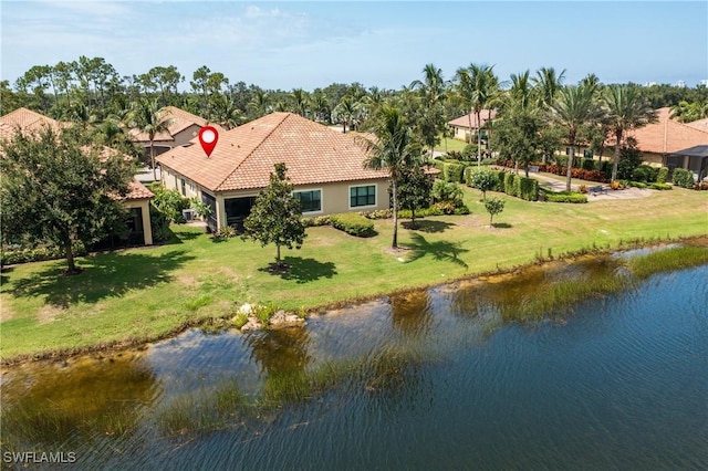 birds eye view of property with a water view