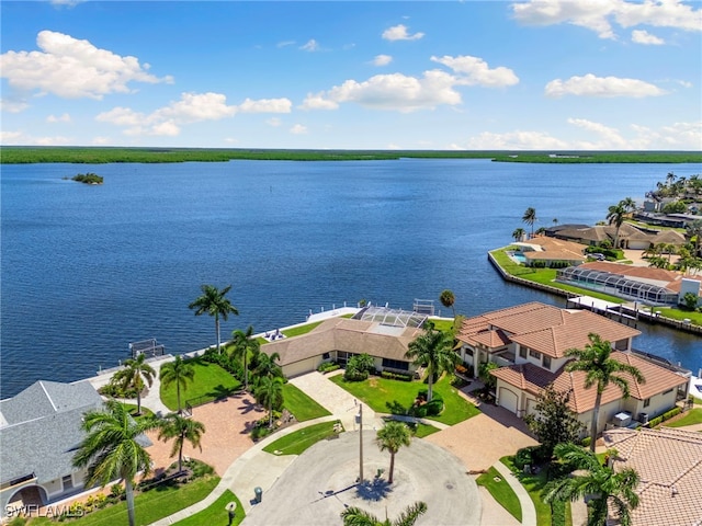 bird's eye view with a water view and a residential view