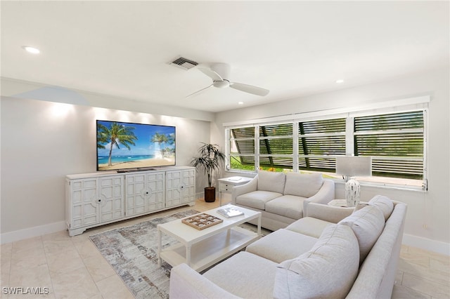 living area featuring recessed lighting, visible vents, ceiling fan, and baseboards