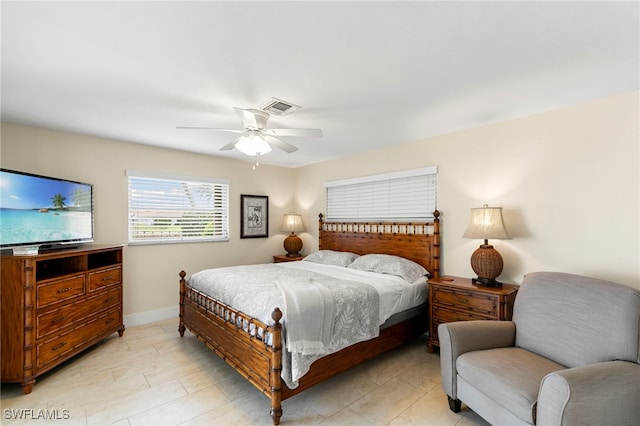 bedroom with visible vents, ceiling fan, and baseboards