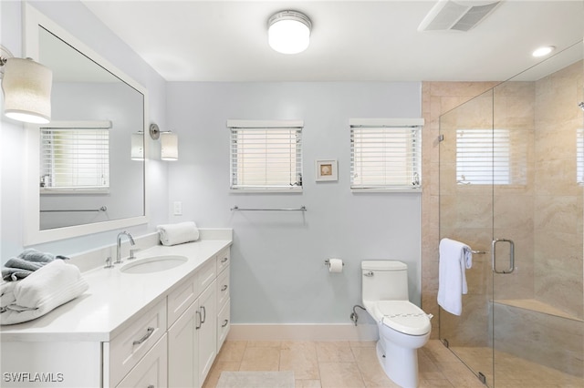 full bath with toilet, vanity, baseboards, tile patterned floors, and a stall shower