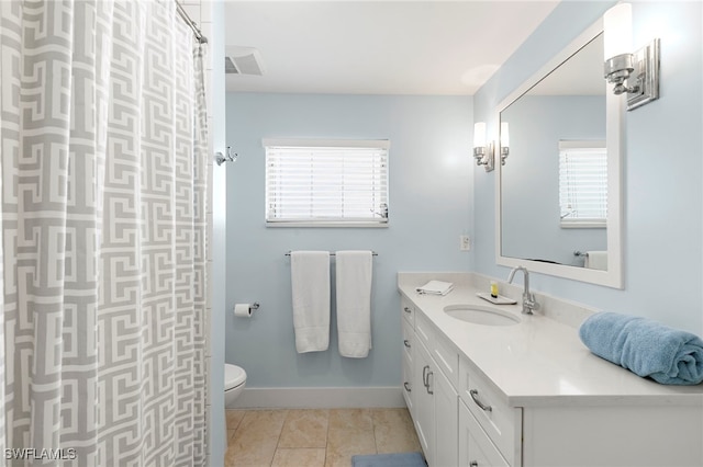 full bath with visible vents, toilet, vanity, tile patterned flooring, and baseboards