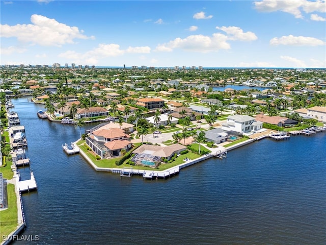 drone / aerial view with a residential view and a water view