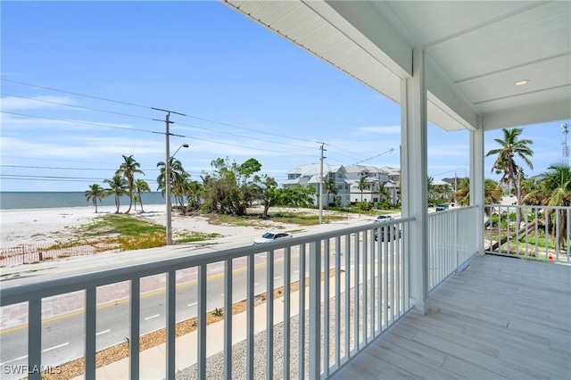 balcony with a view of the beach and a water view