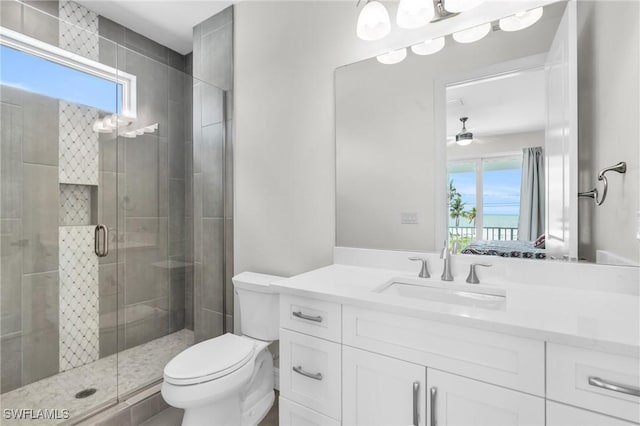 bathroom with toilet, ensuite bath, vanity, and a shower stall