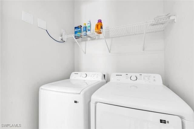 laundry room with laundry area and washing machine and dryer