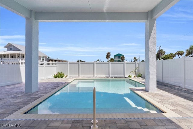 view of swimming pool featuring a fenced backyard, a fenced in pool, and a patio