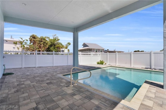 view of swimming pool featuring a patio, a fenced backyard, and a fenced in pool