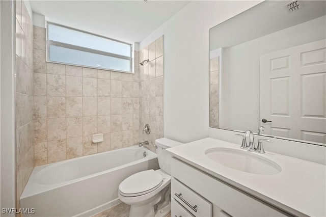 bathroom with toilet, shower / bath combination, vanity, and visible vents